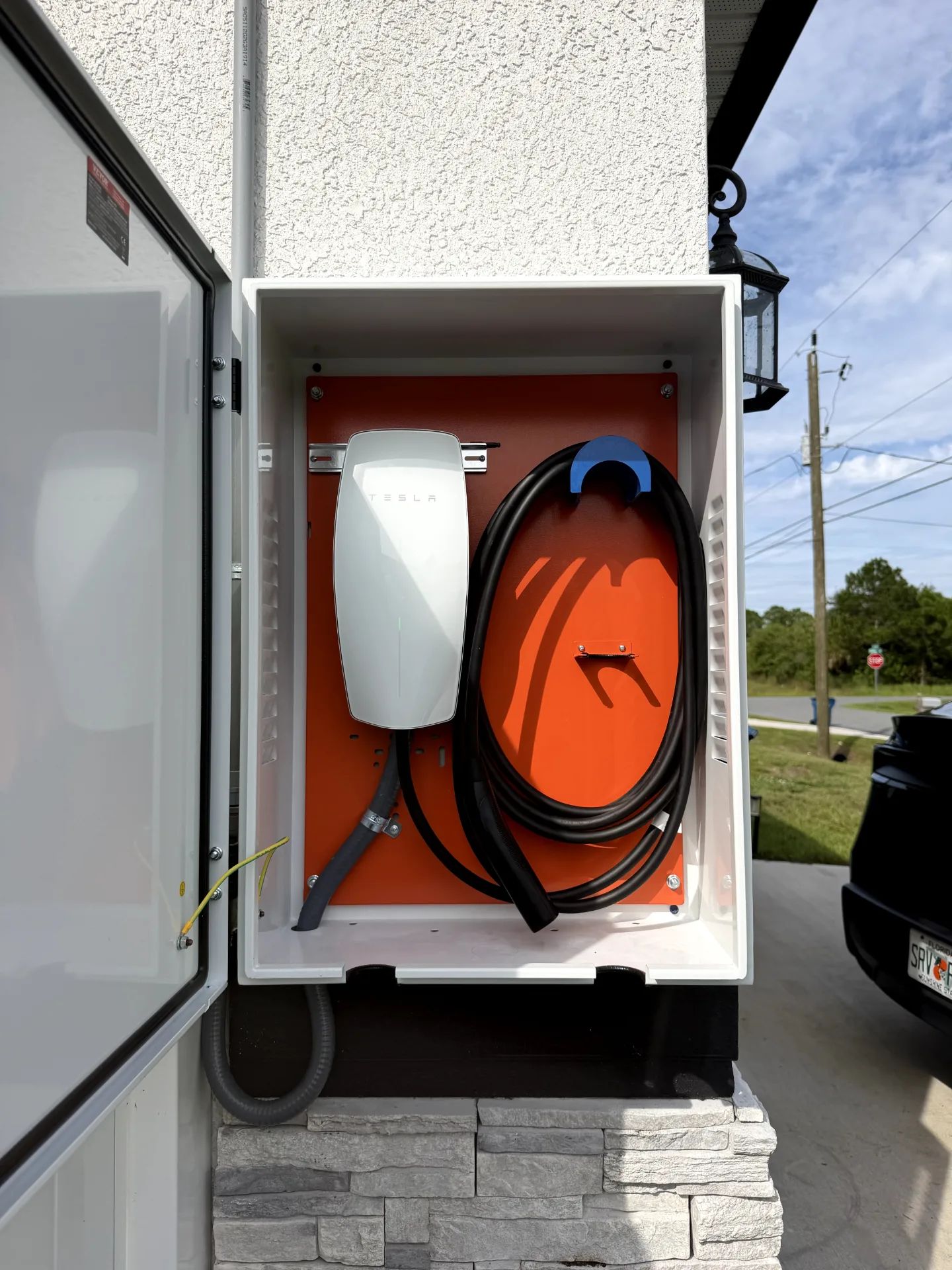 Licensed electrician installing a home EV charger in Florida
